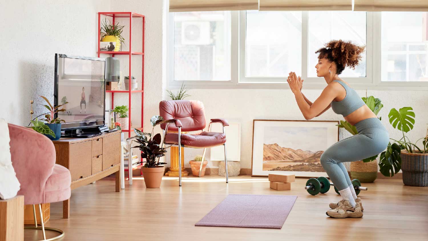 A woman working out in her living room