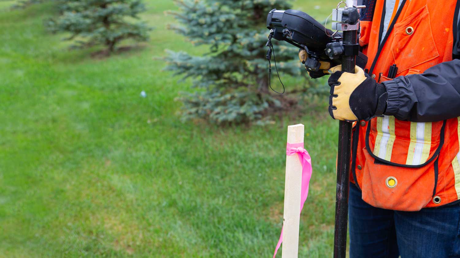 boundary surveyor with lot stake
