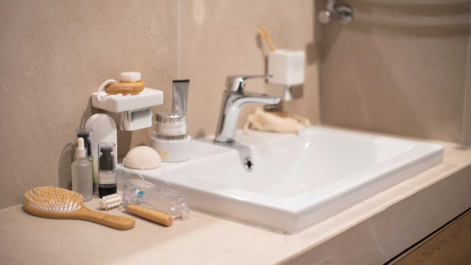 Bathroom toiletries on top of a bathroom vanity