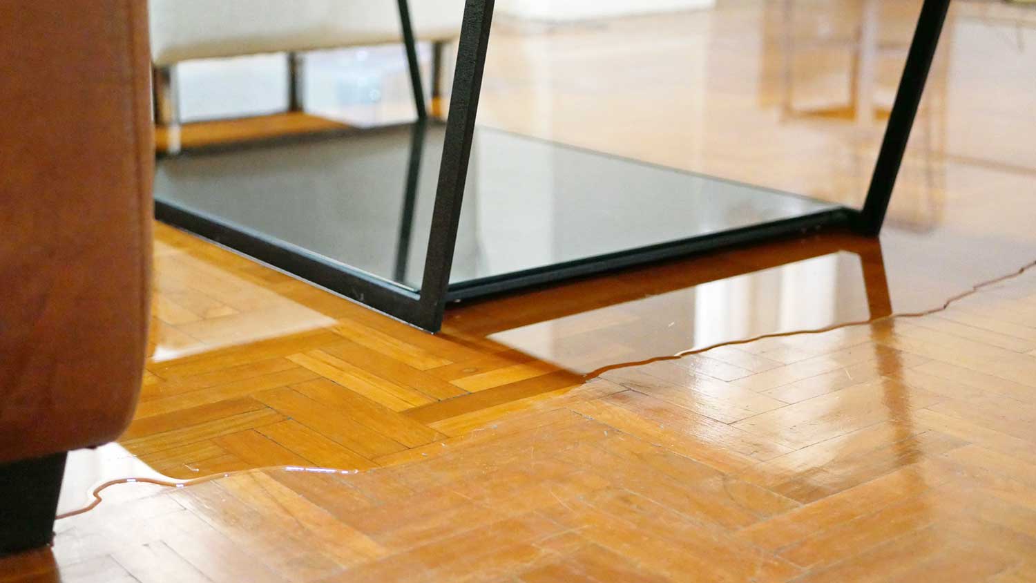 Hardwood floor damage caused by a water leak