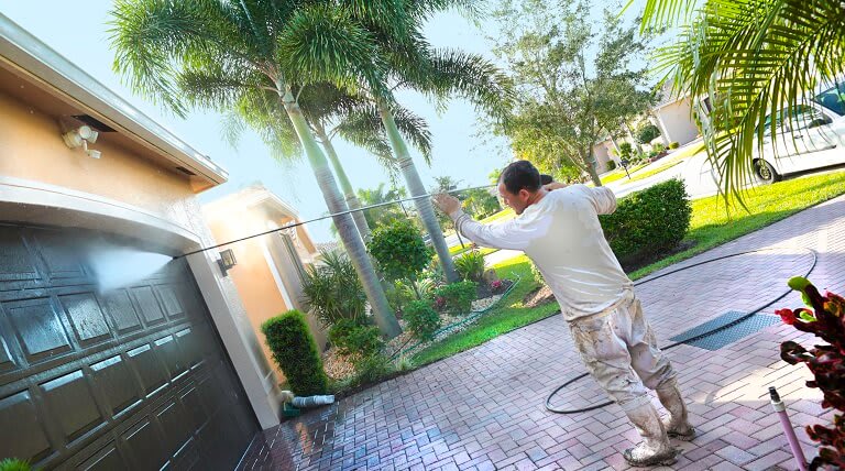 professional power washes a fancy California home