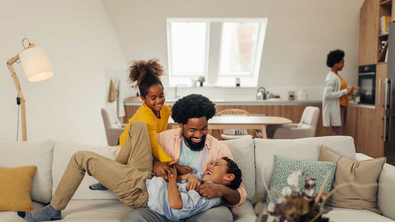 Father playing with his children at home
