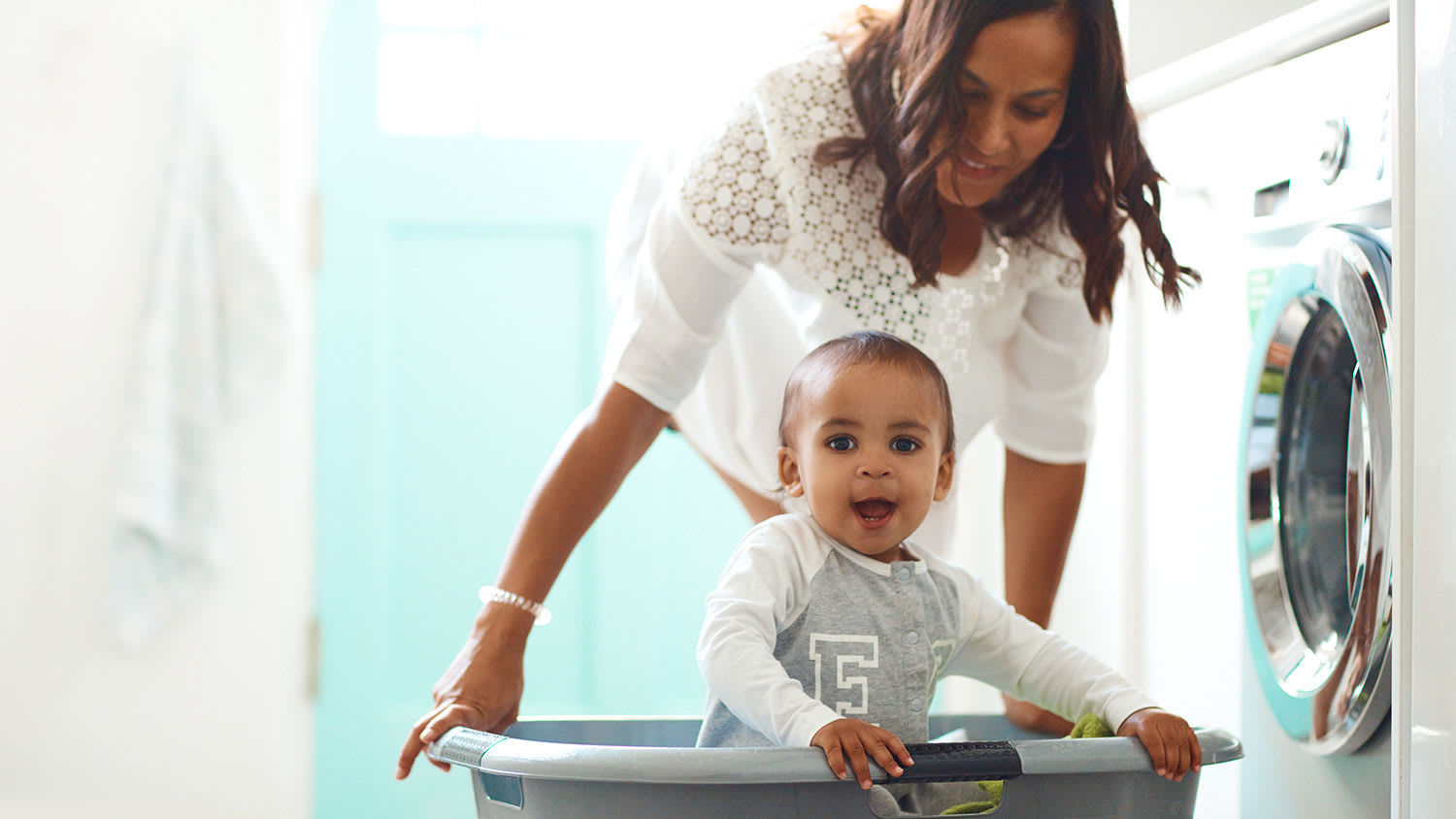 A mother and child in a laundry room