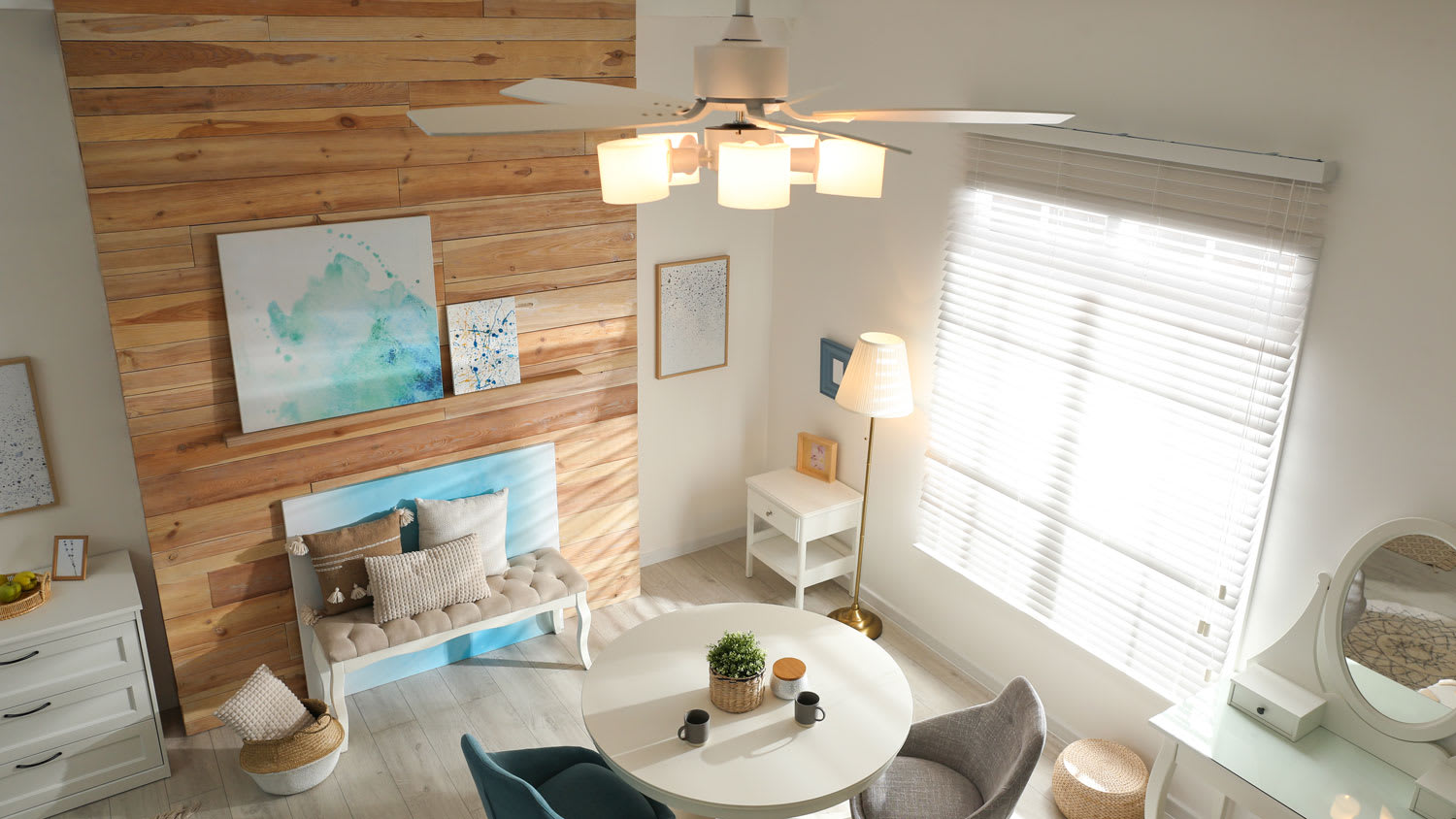 A stylish vintage lounge area with a ceiling fan