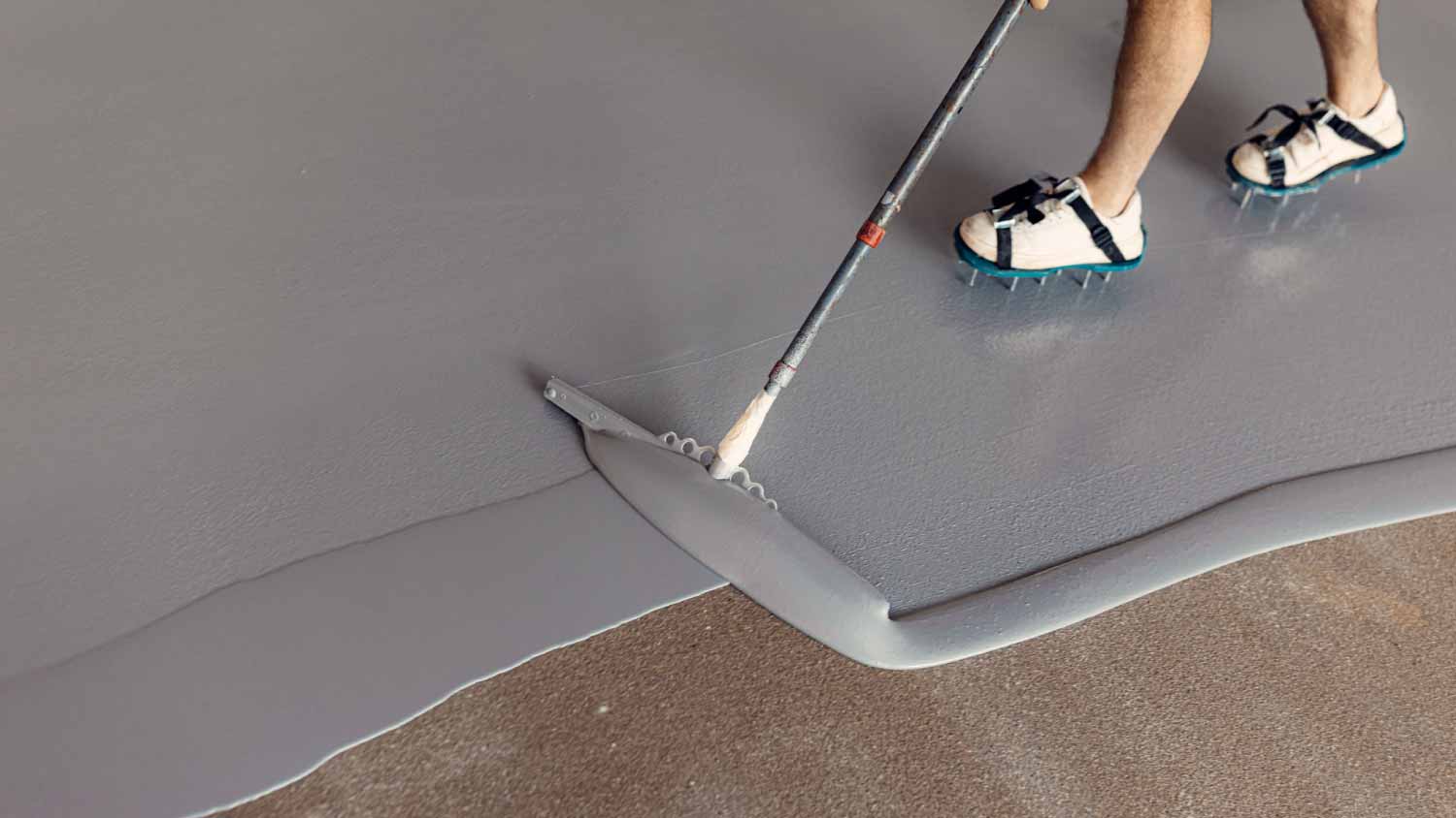 Worker applying epoxy resin