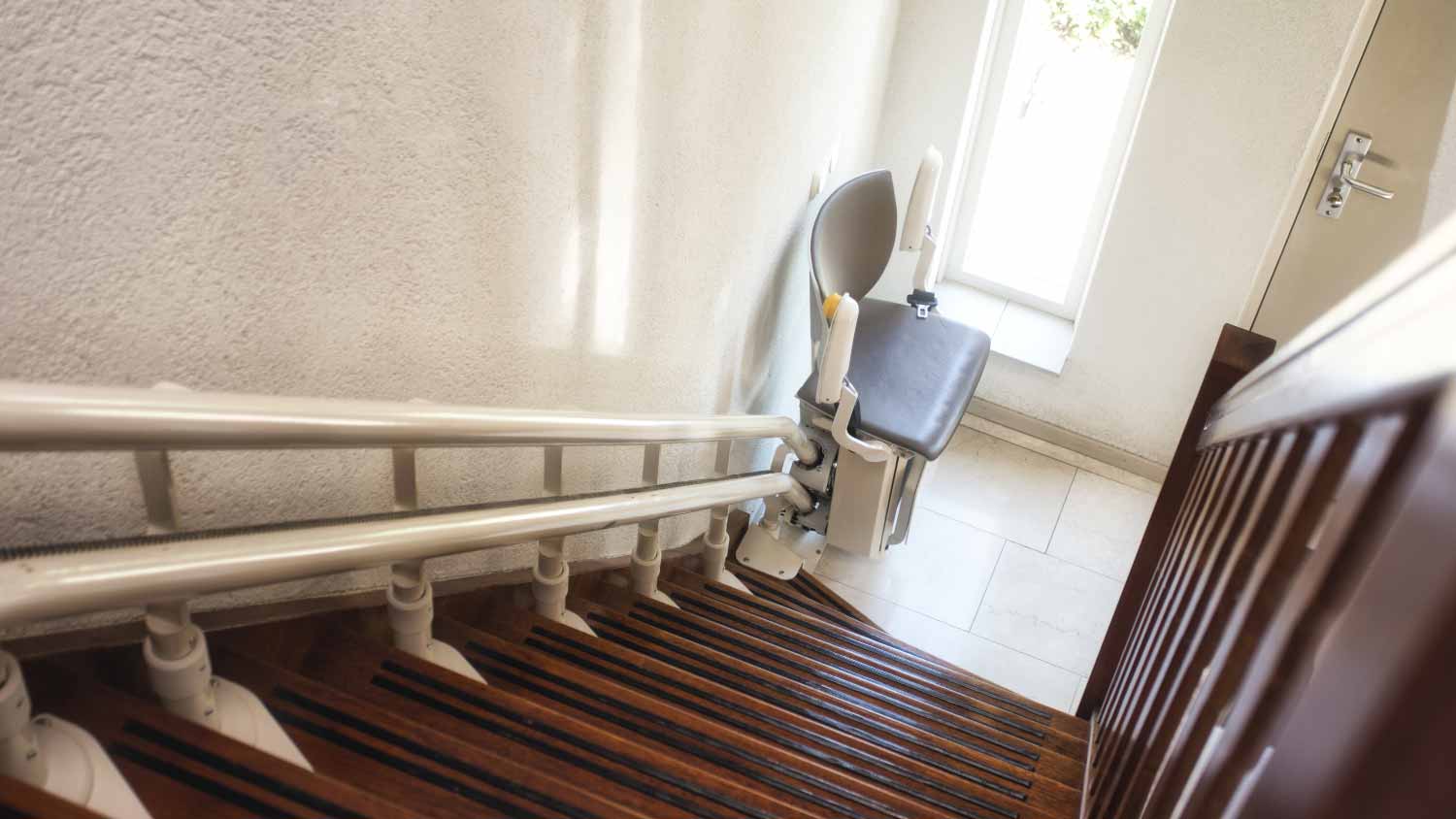Automatic stair lift on staircase