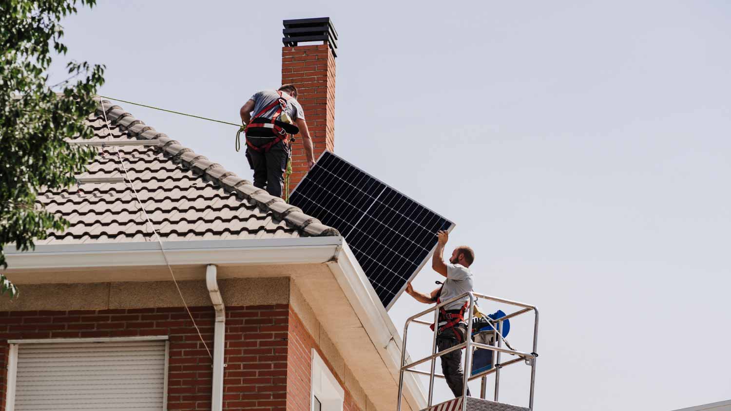 Technicians installing solar panels