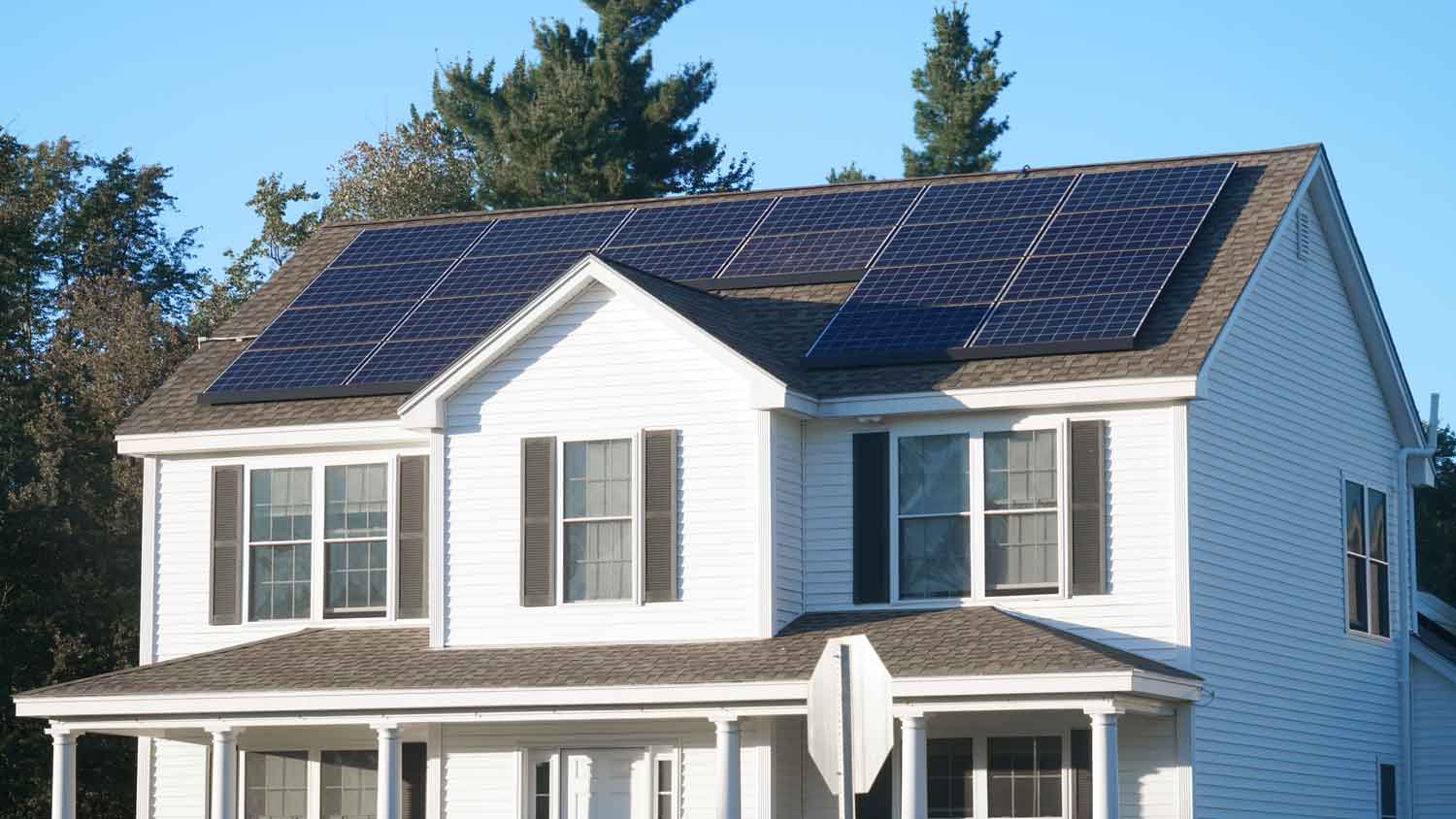white house with solar panels