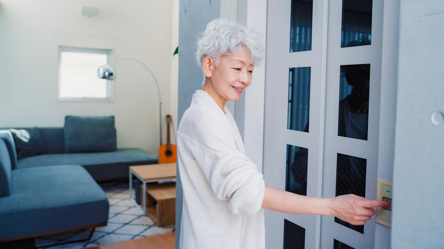 woman using elevator in home
