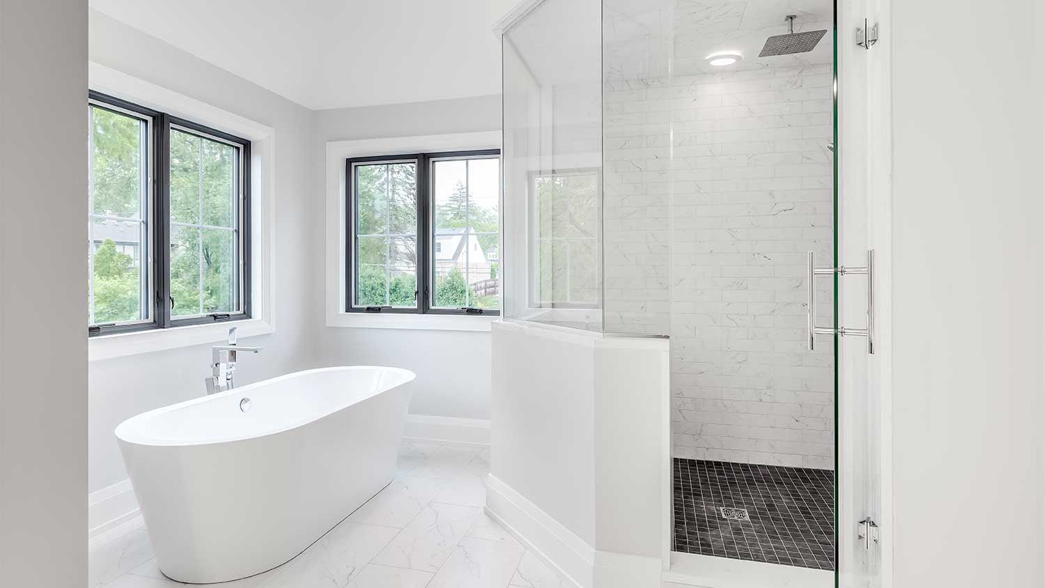 A view of a bathroom with a walk-in shower