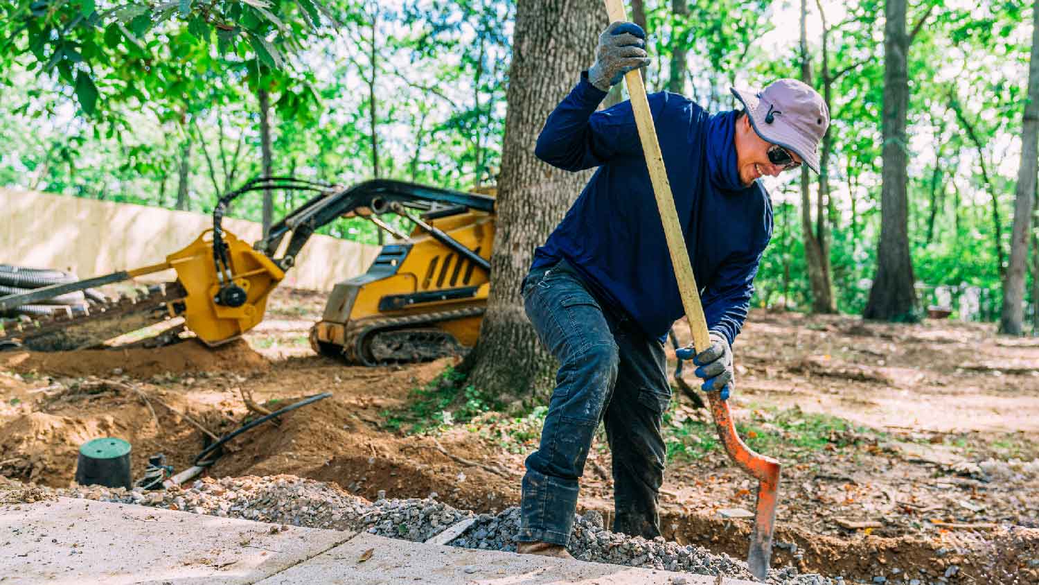 A man trenching a garden