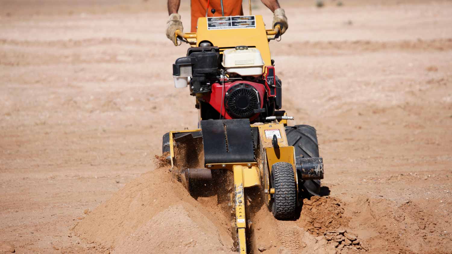 Man using a trenching machine