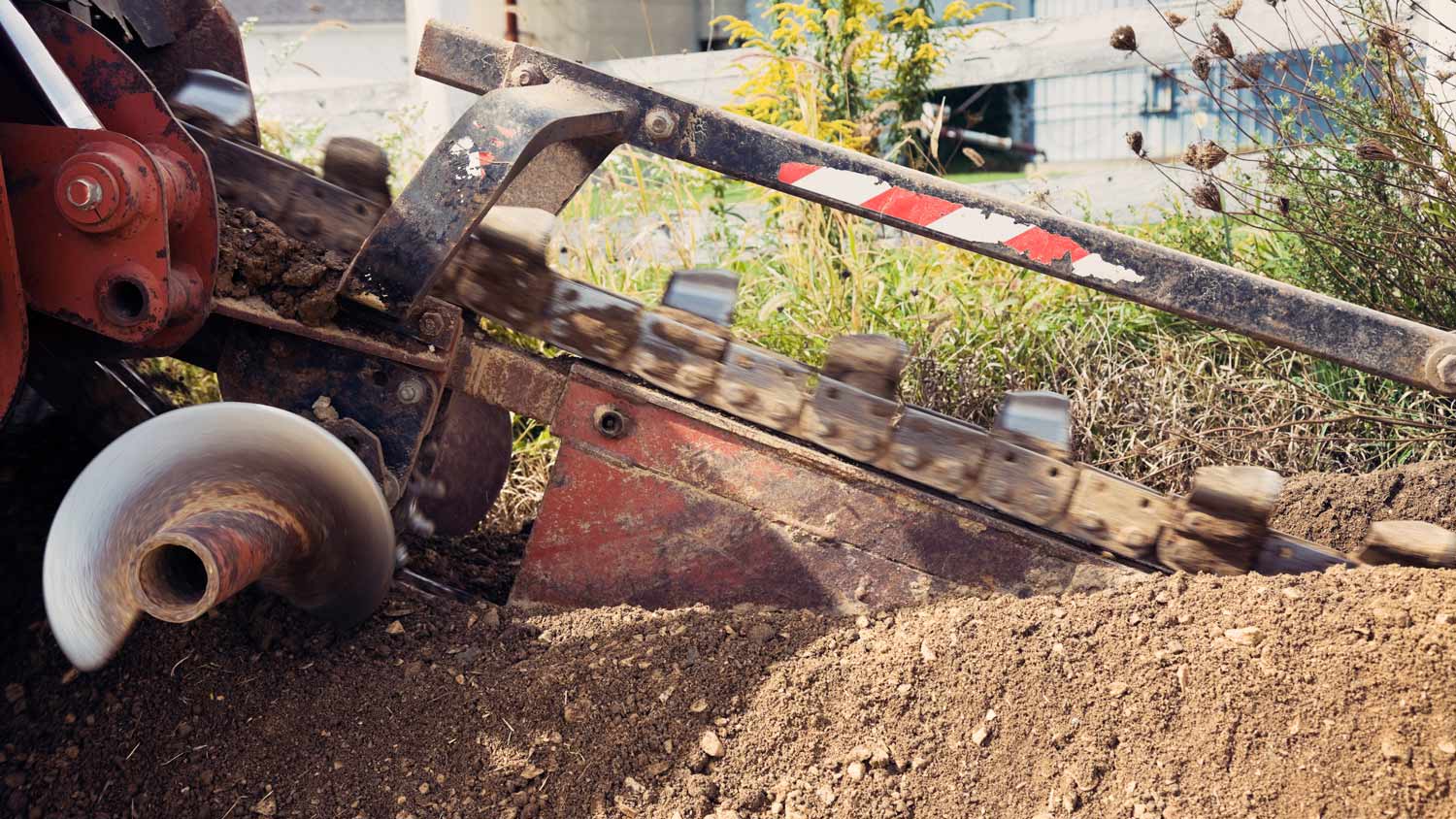 Red trench machine in action