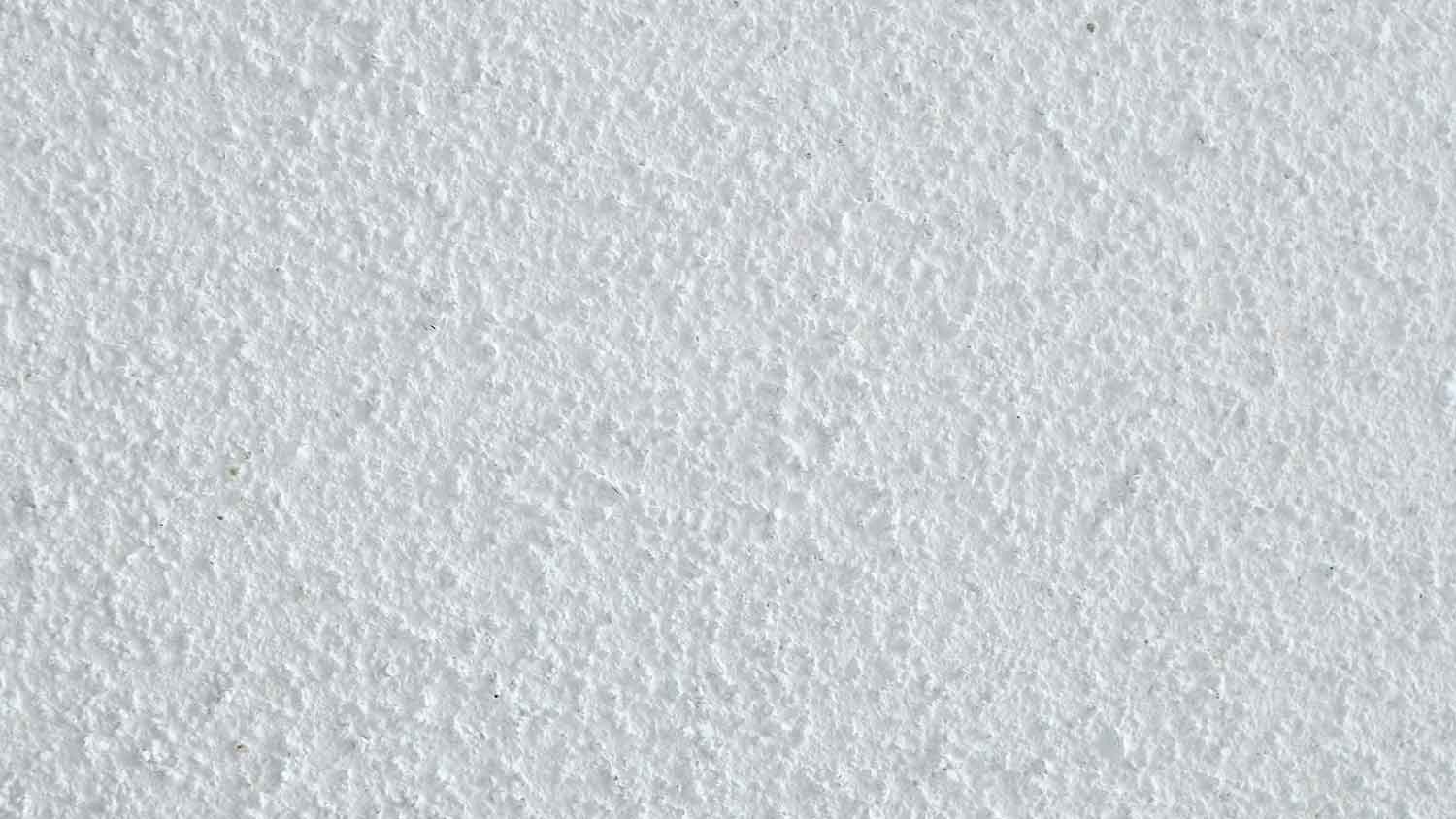 Closeup of a white popcorn ceiling texture
