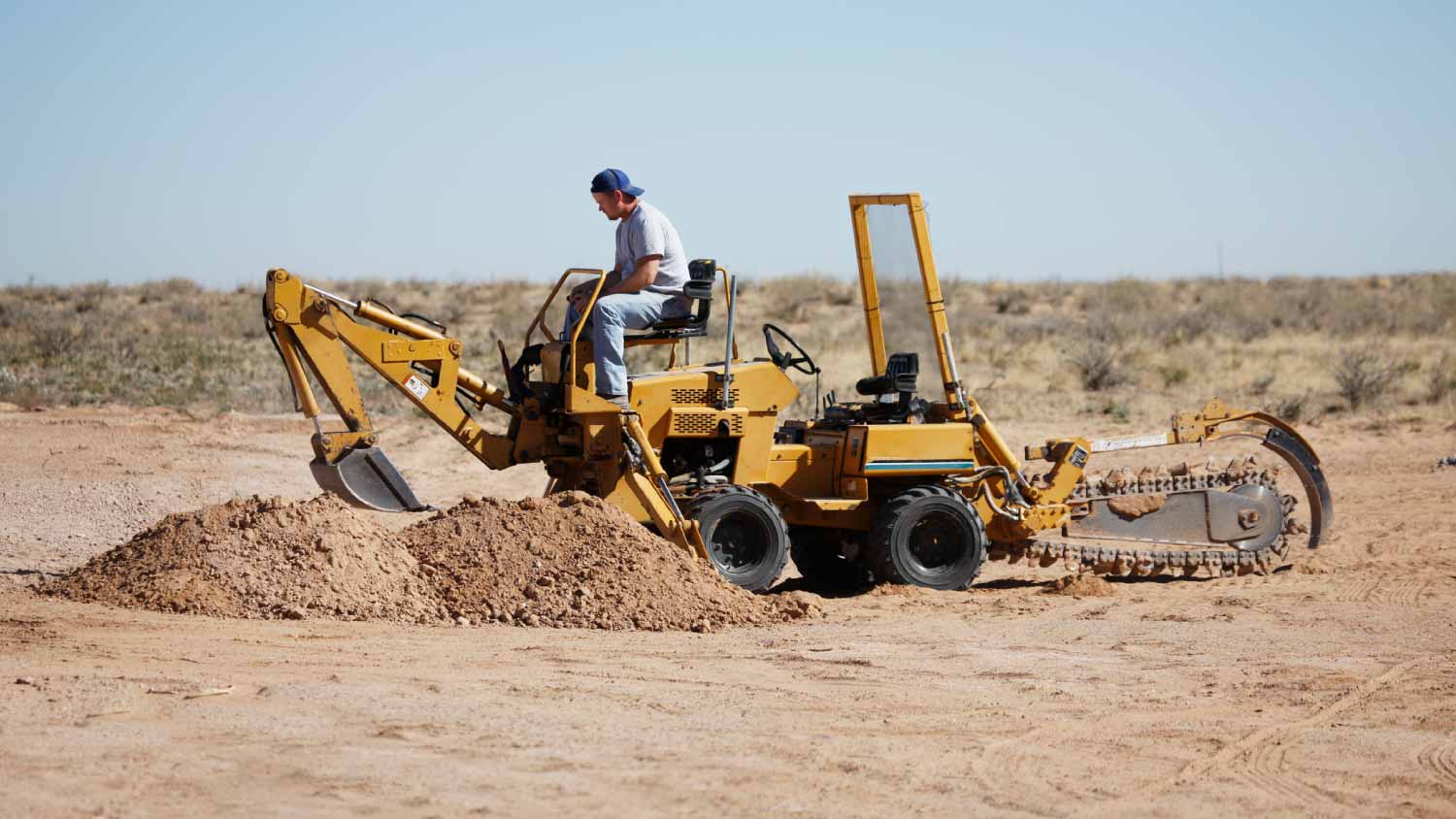 Man Operating a trenching machine