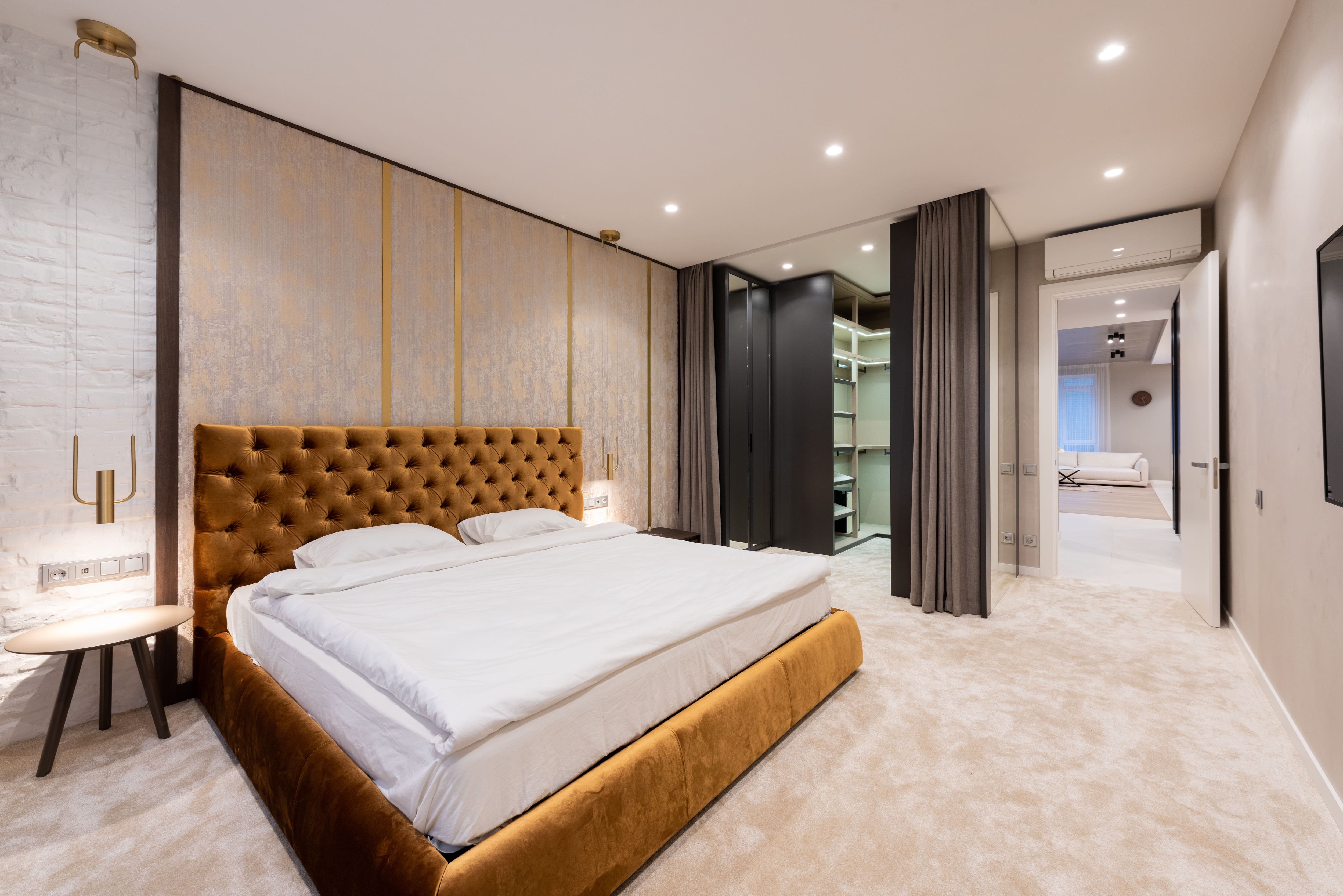 A bedroom with a curtain closet door