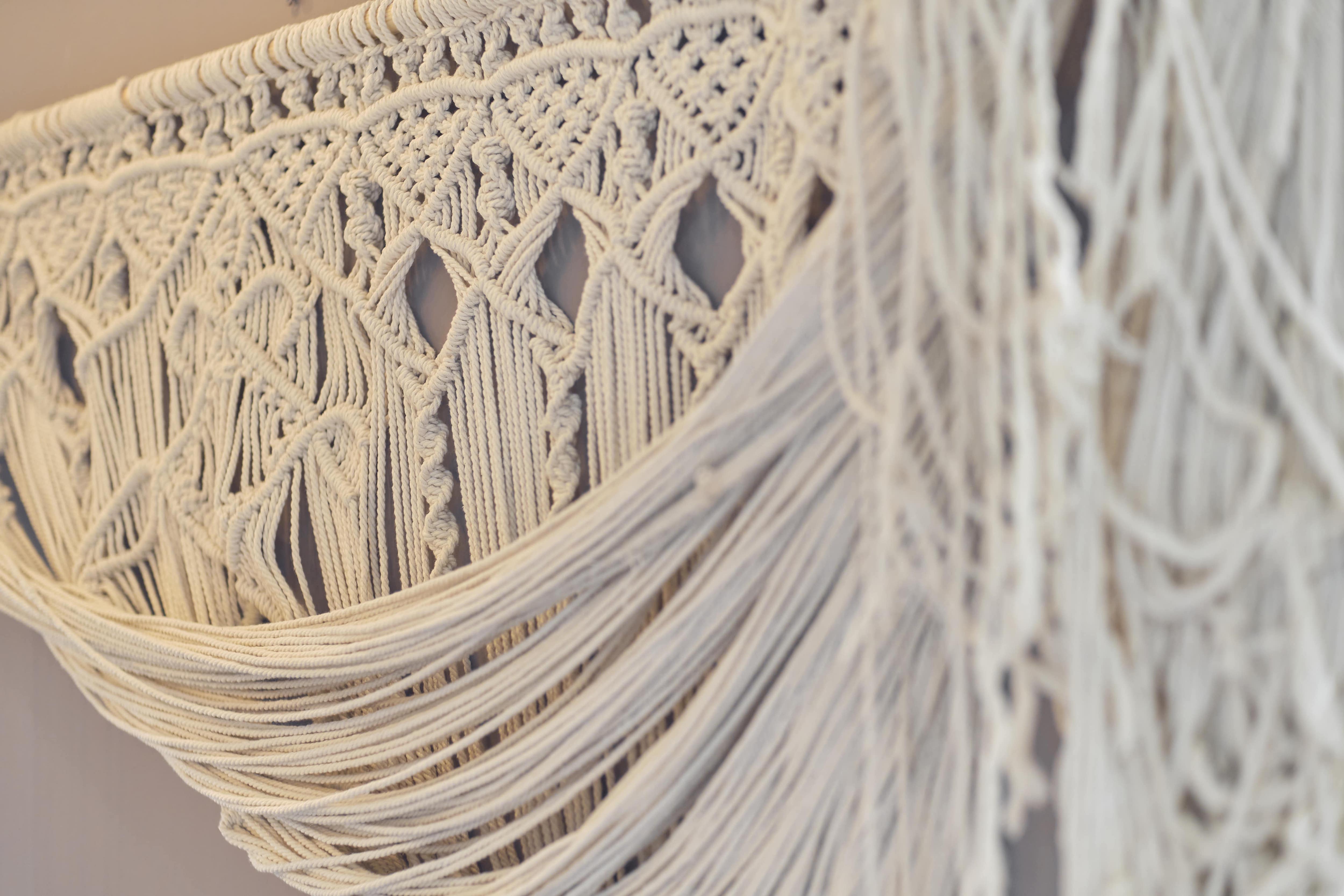A handmade macrame curtain