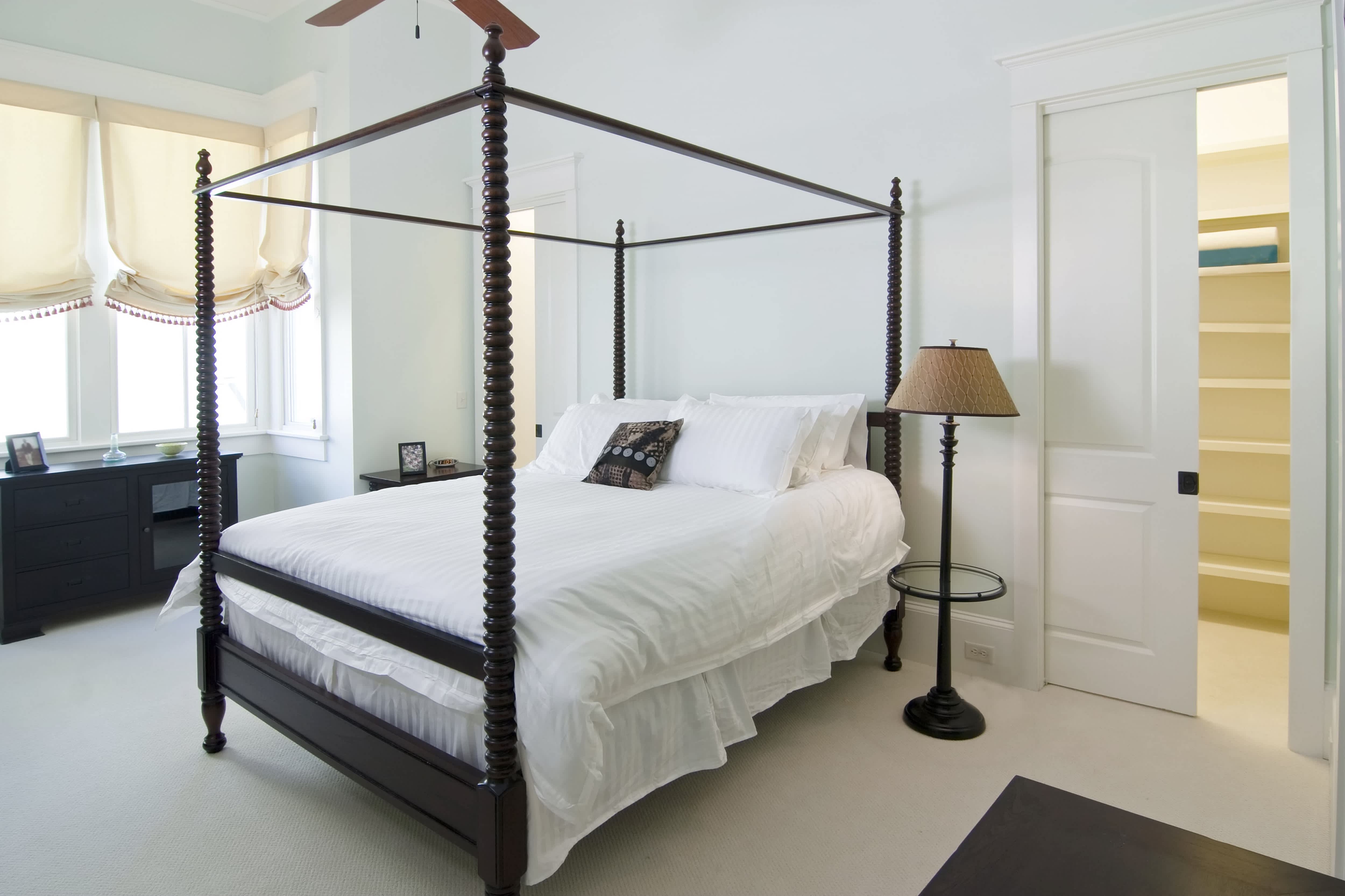 A bedroom with a pair of pocket doors
