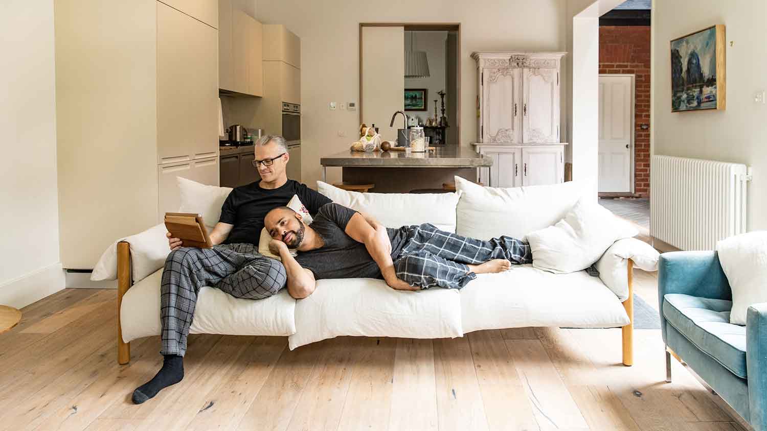 Couple wearing pajamas relaxing on the couch