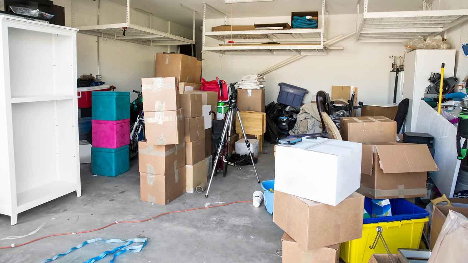 Residential garage full of clutter