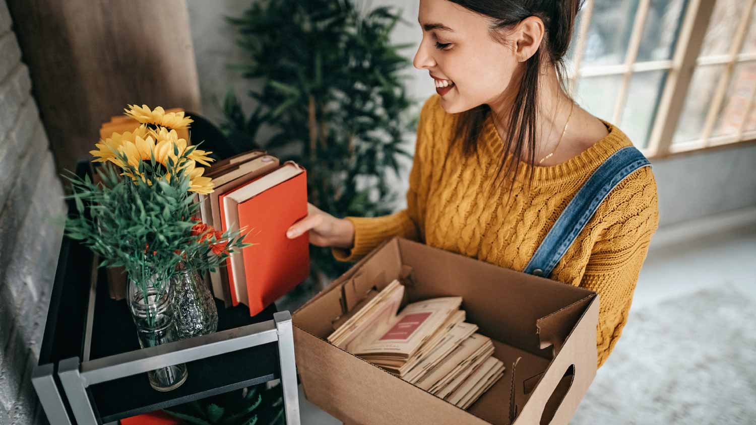 Woman packing books