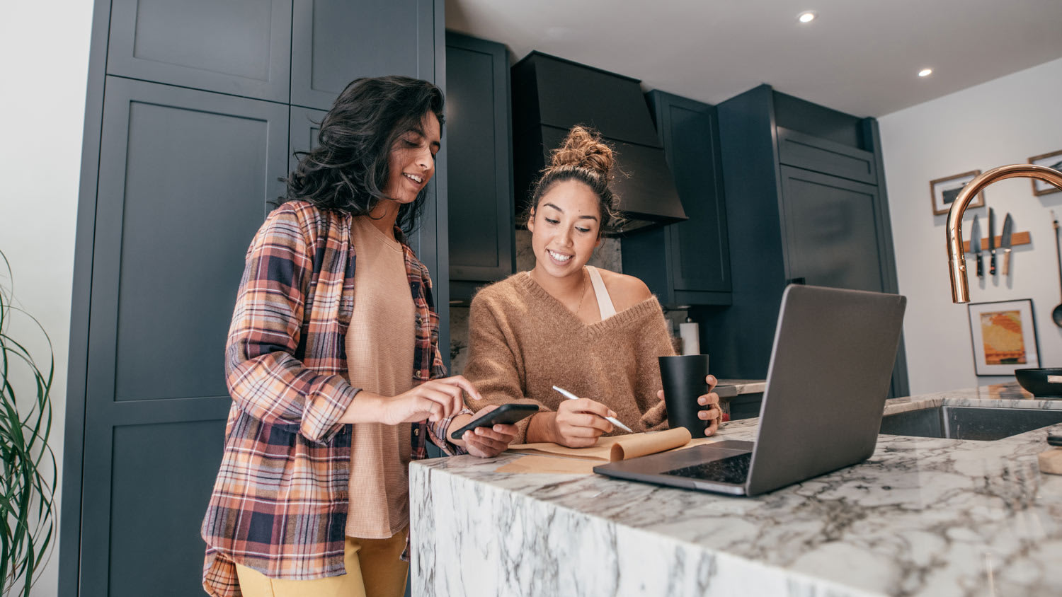 An insurance agent checking paperwork with homeowner