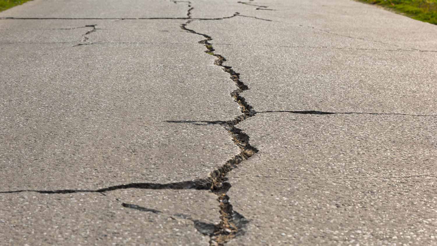 Surface of concrete driveway with crack