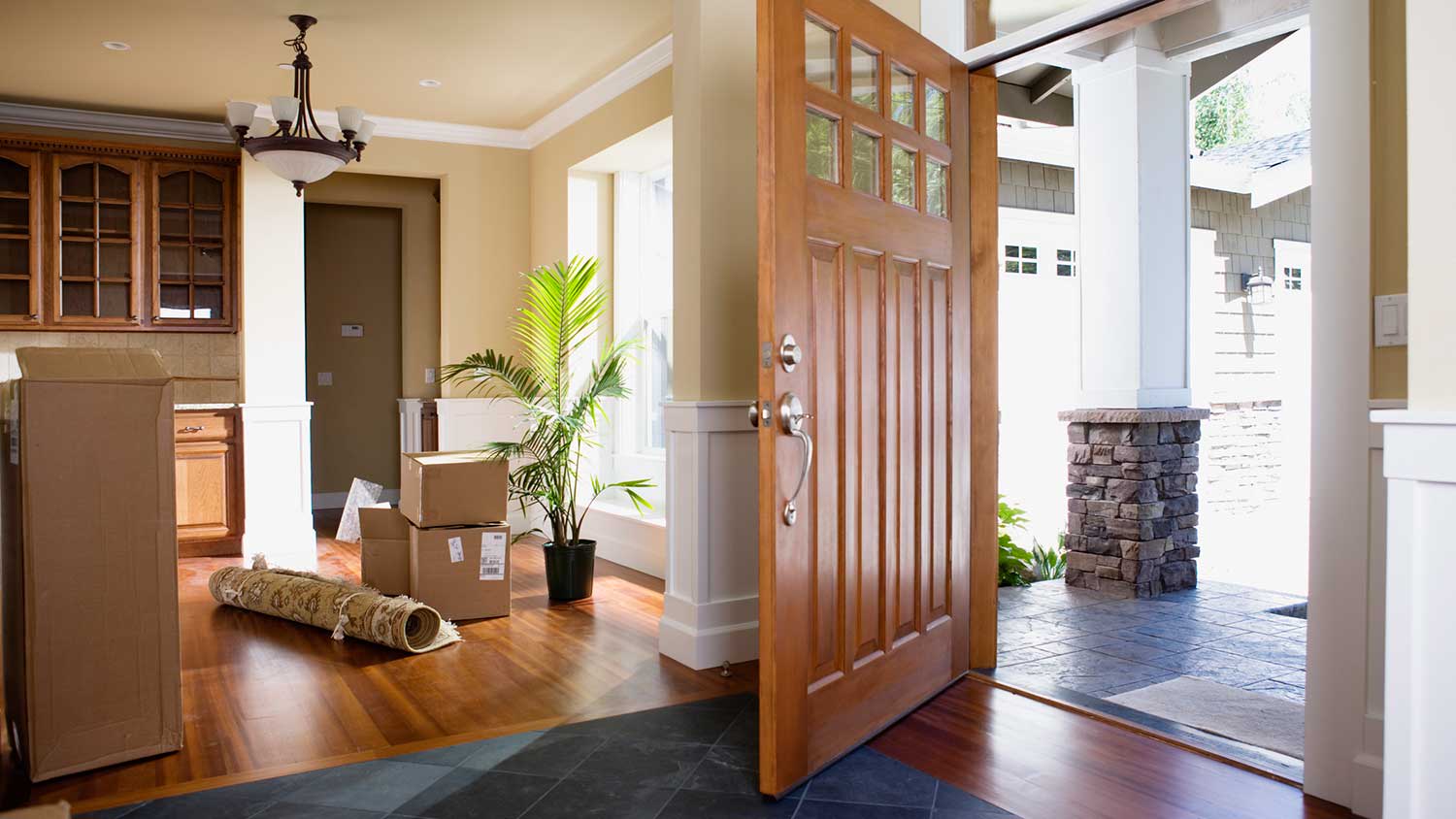 An open front door of a house with a door sweep