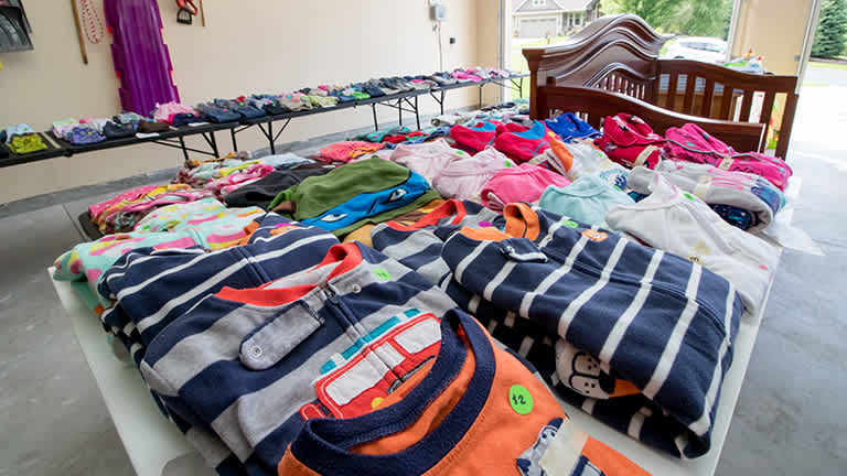 Garage sale items set up on tables