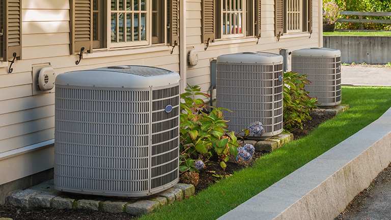 A heating and cooling system situated outdoors