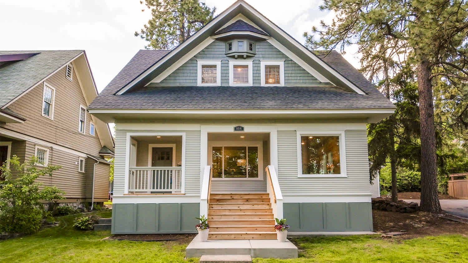 small grey house in neighborhood