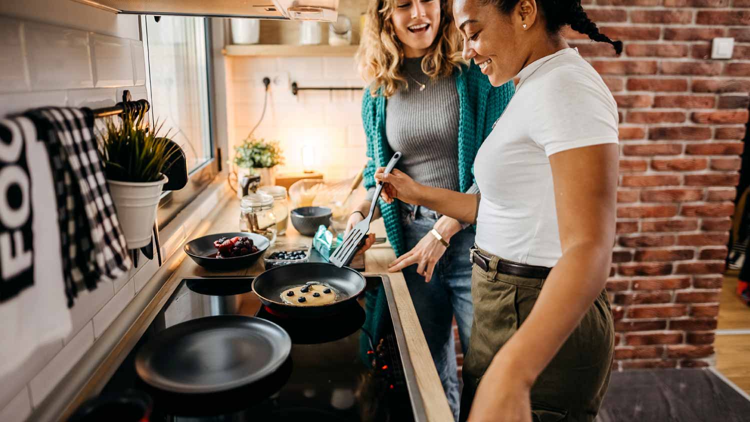 Friends cooking in the kitchen