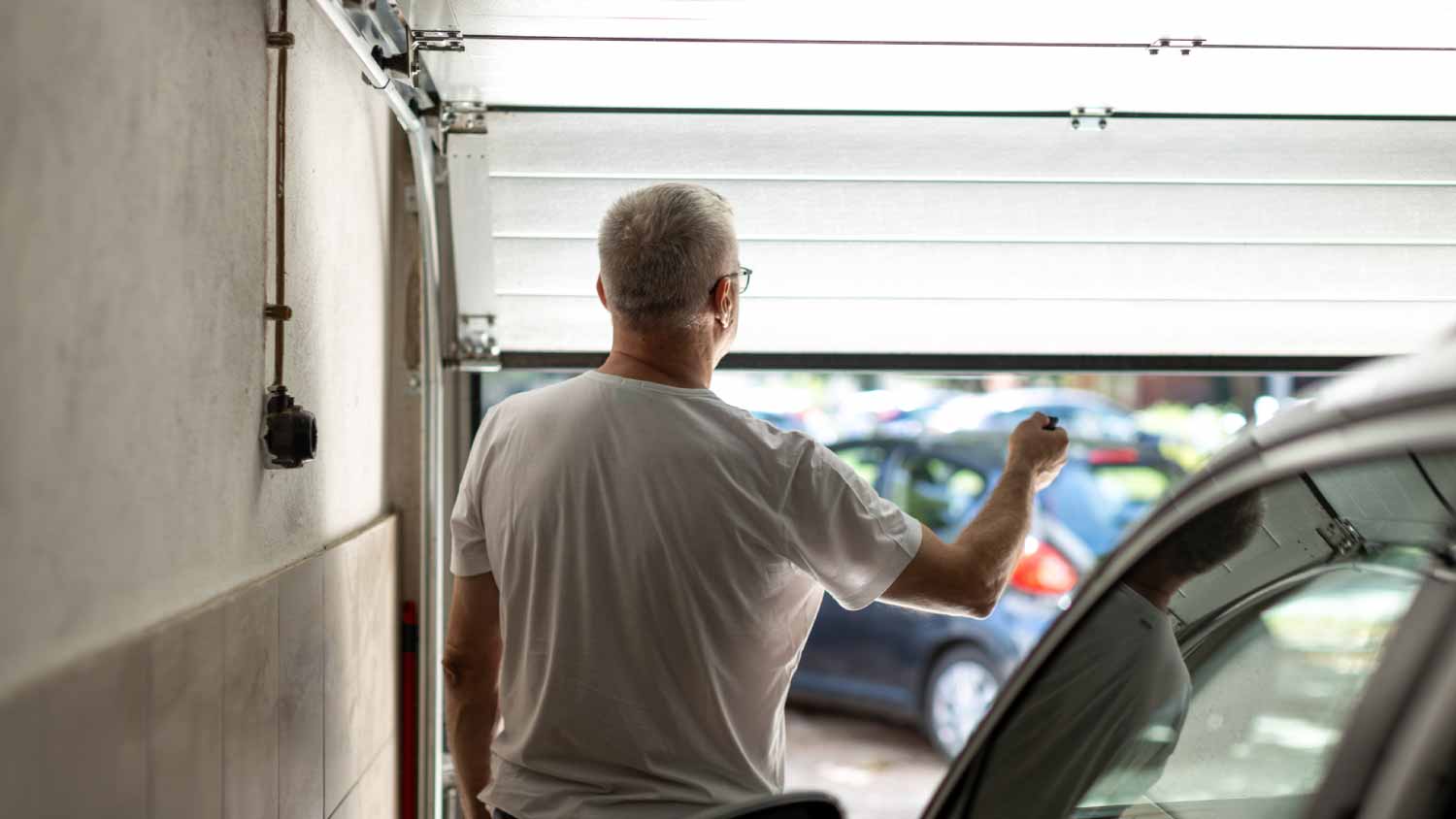 Man opening garage door