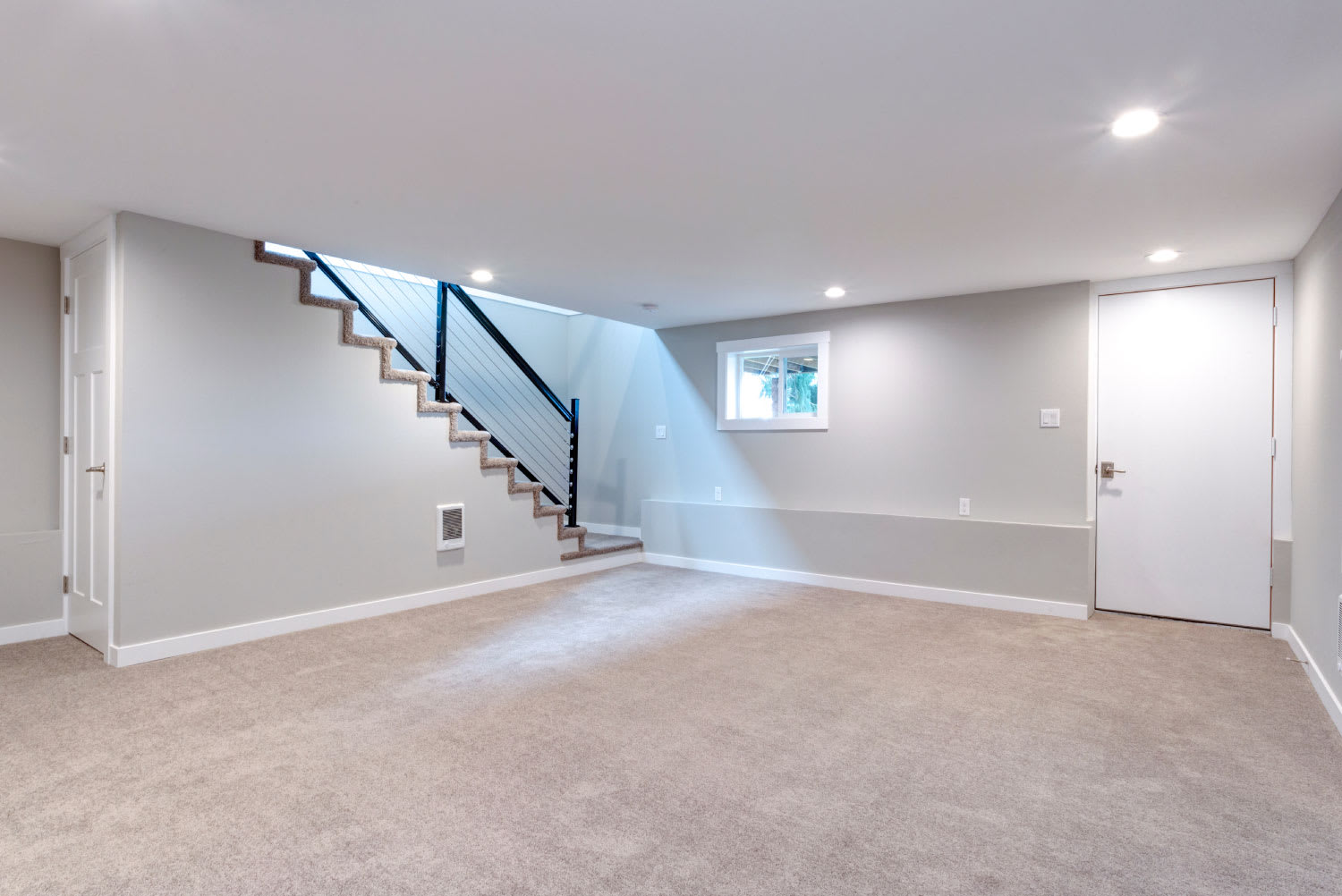 Light spacious basement area with staircase
