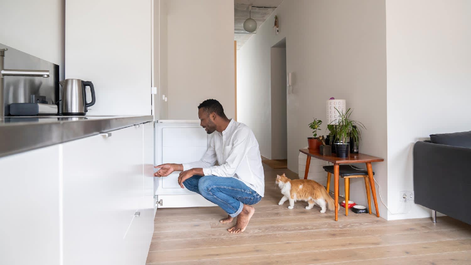 A man looking into the freezer