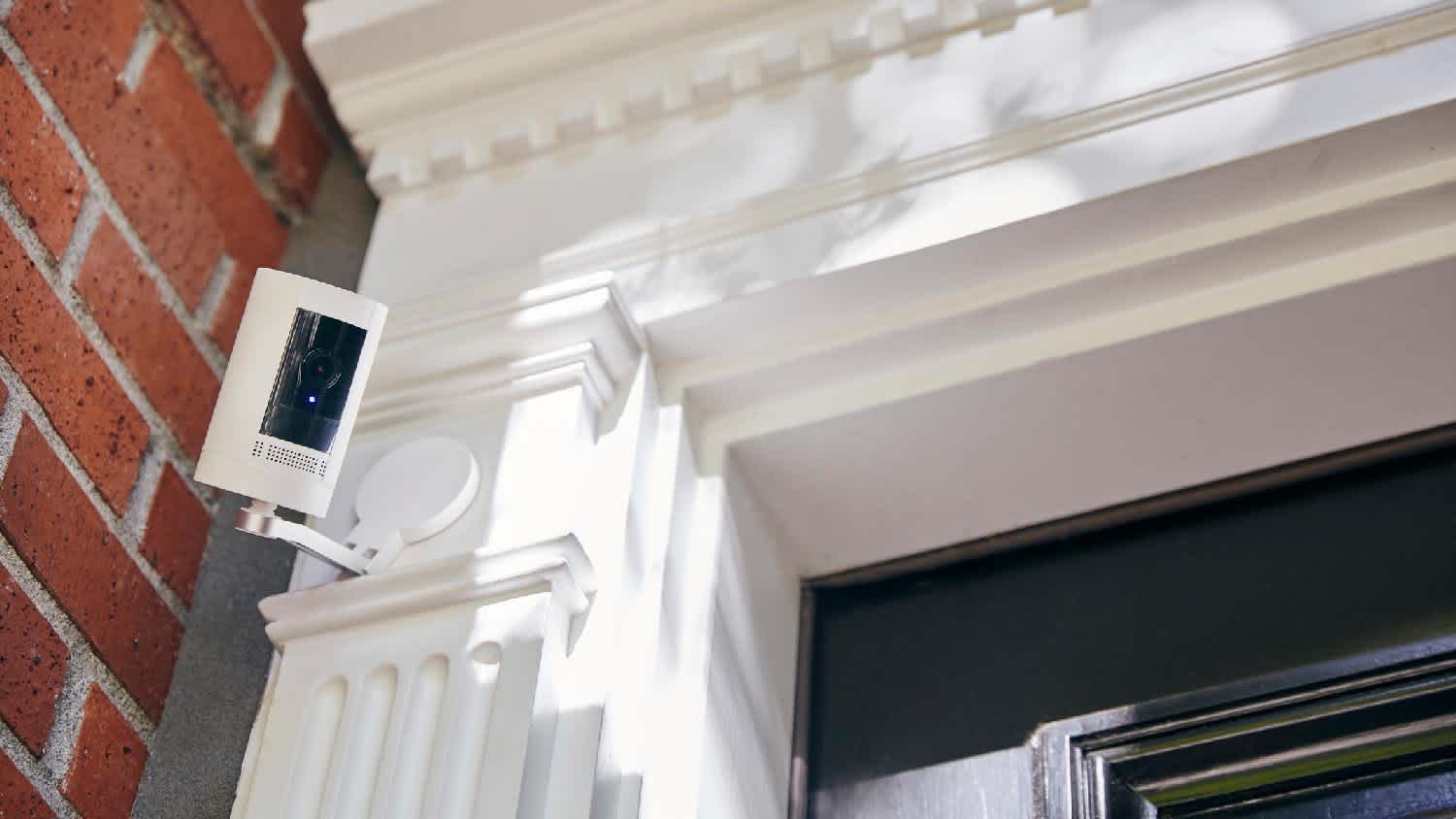A motion detector on the exterior of a house