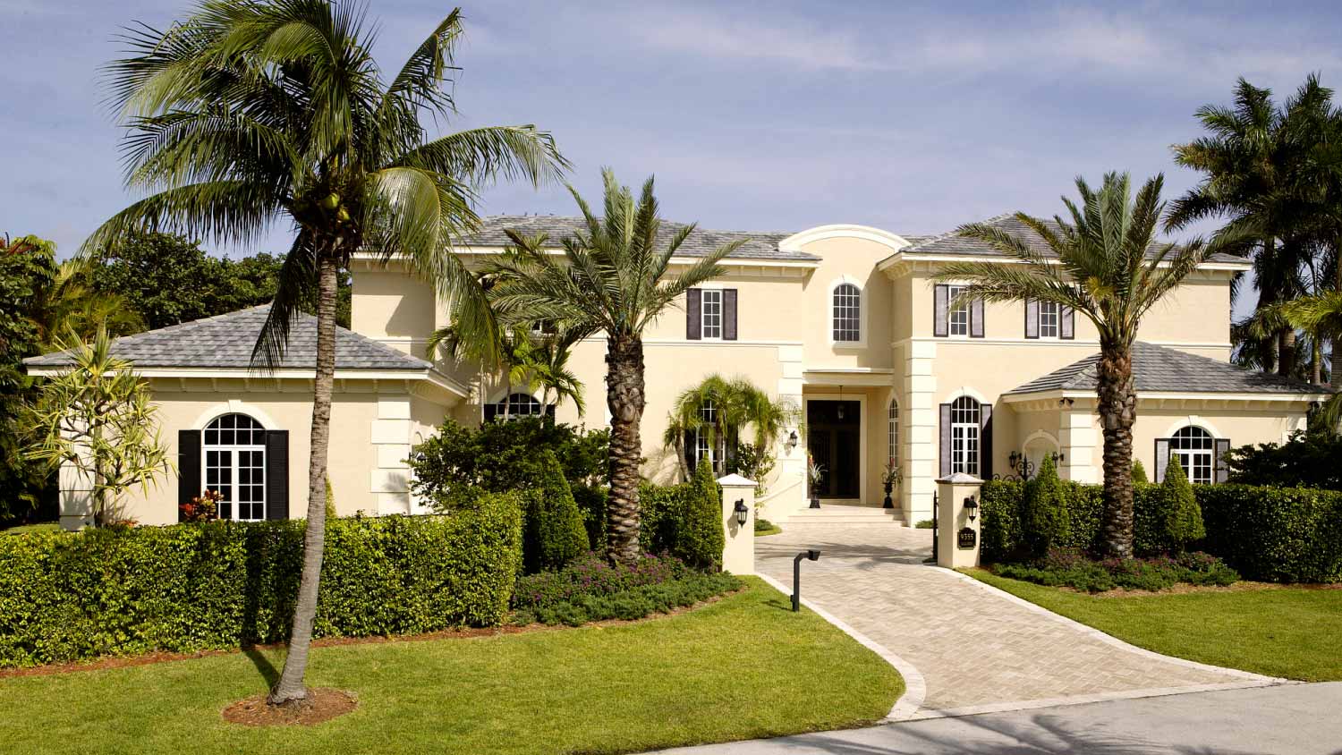 Large home with palm trees