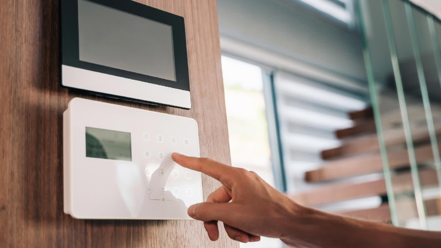 A person operating a home security system