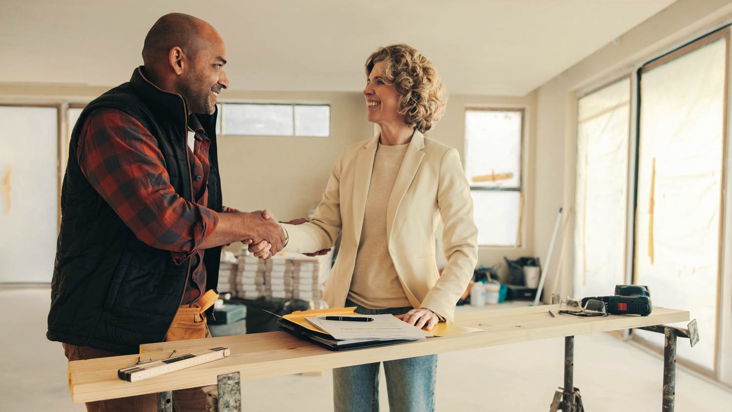 contractor and homeowner shaking hands
