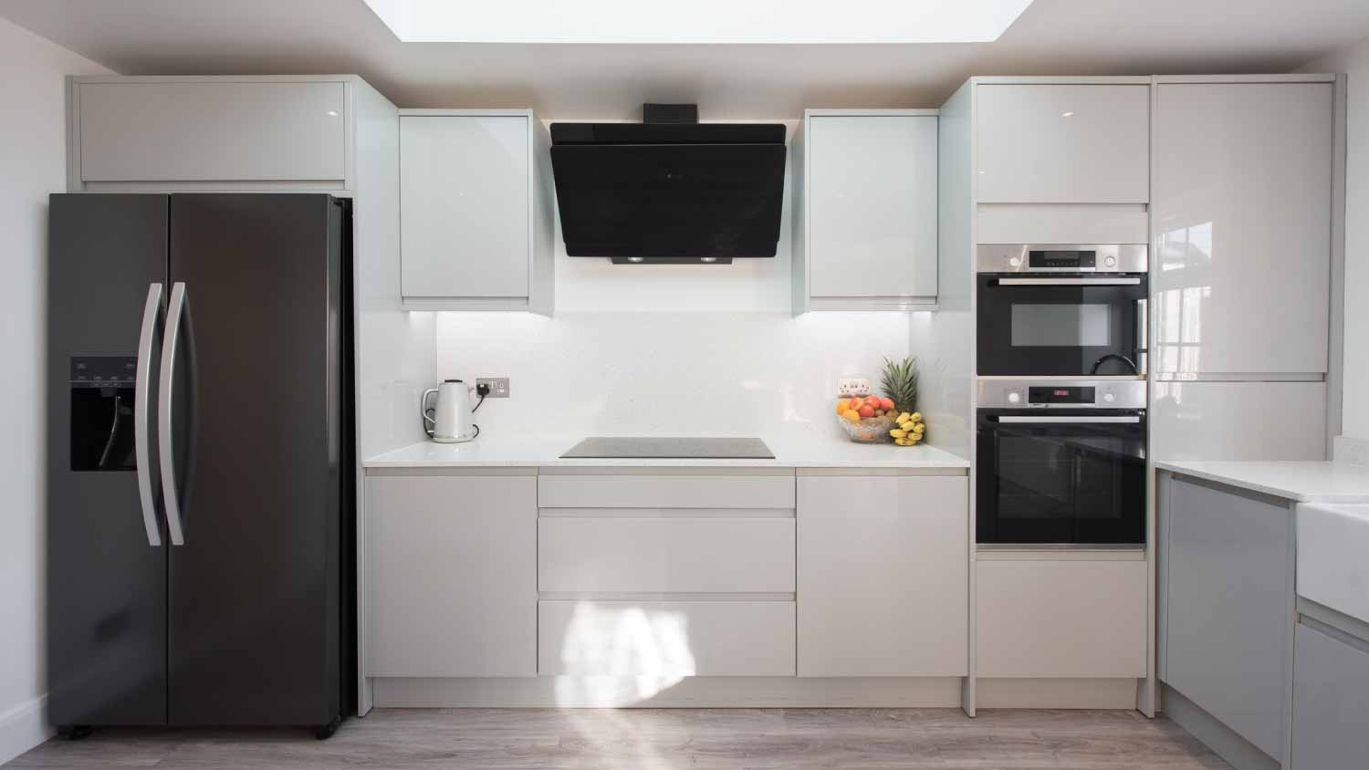 Glossy Kitchen with large black refrigerator