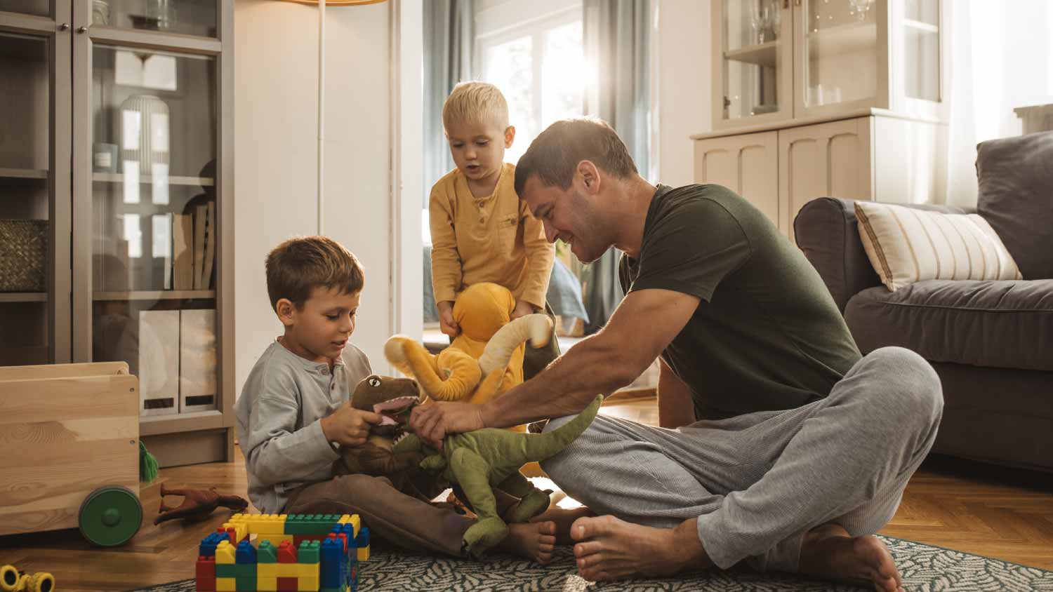 Dad playing with his two little sons
