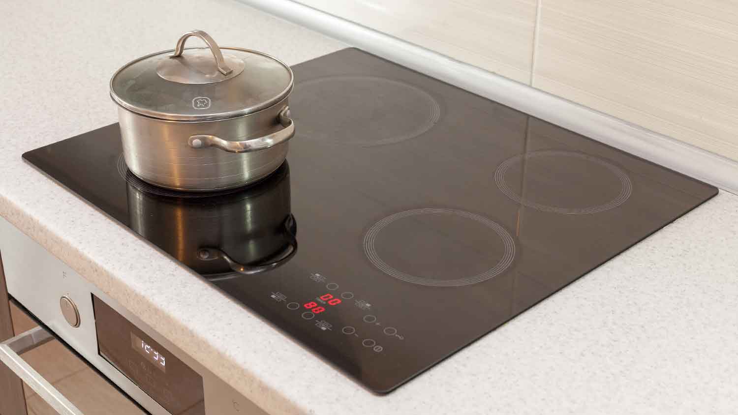Induction stove with magnetic cookware on top