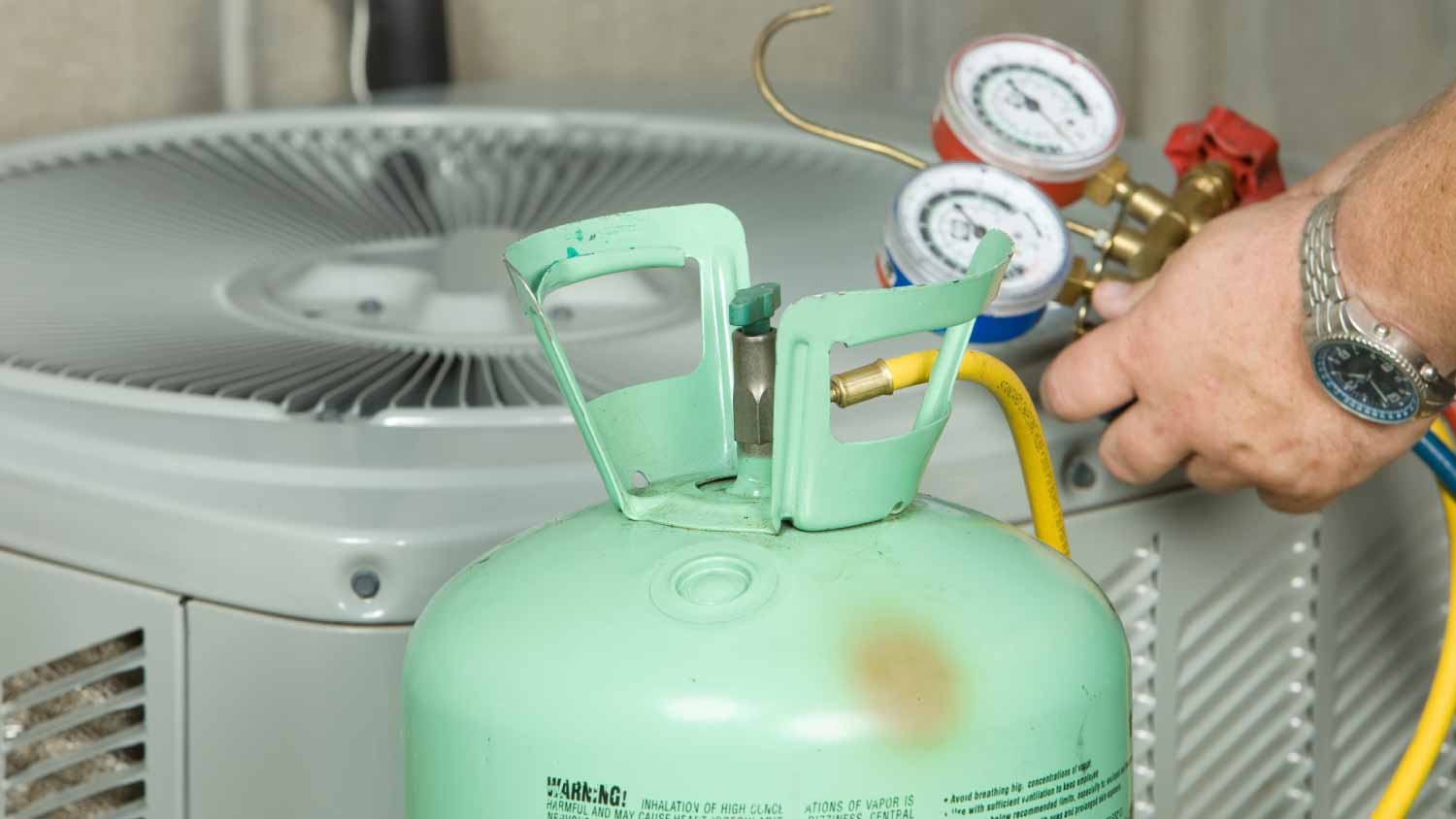Worker checking air conditioner system