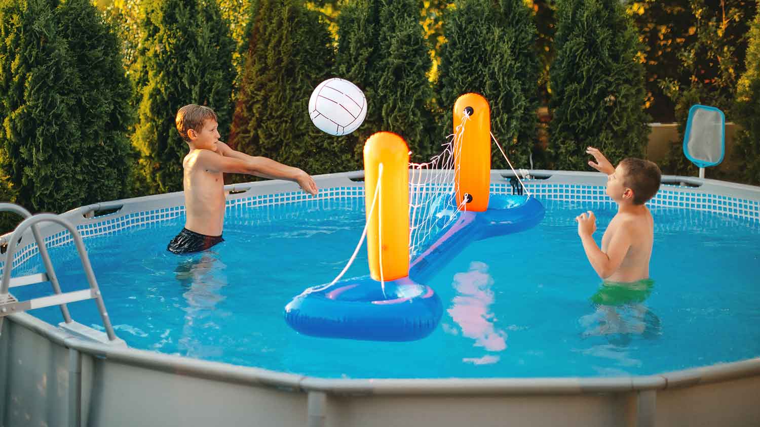 Kids playing volleyball in the swimming pool