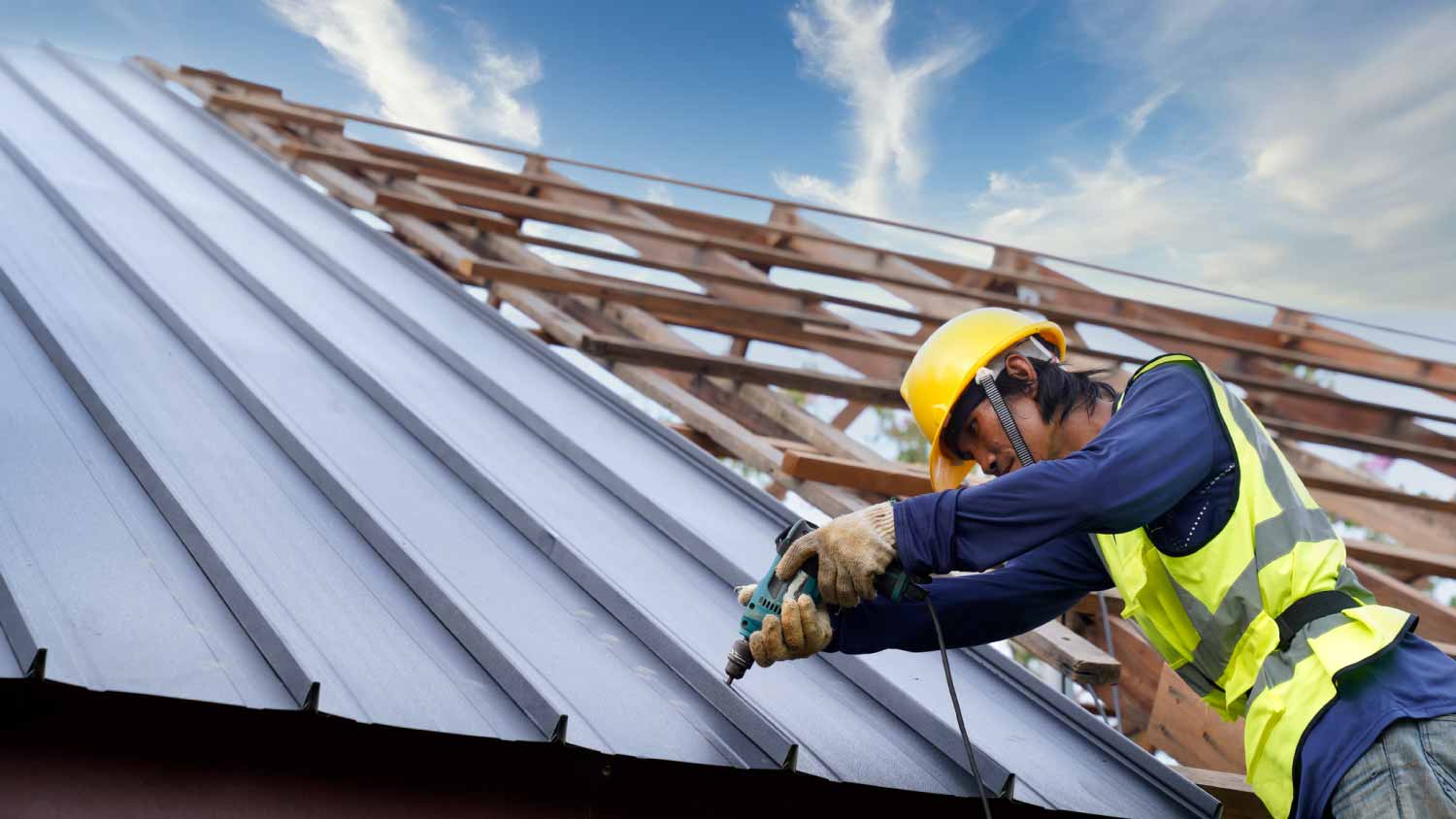 Worker installing new roof
