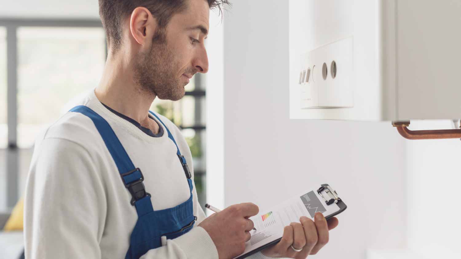 Plumber doing a boiler check