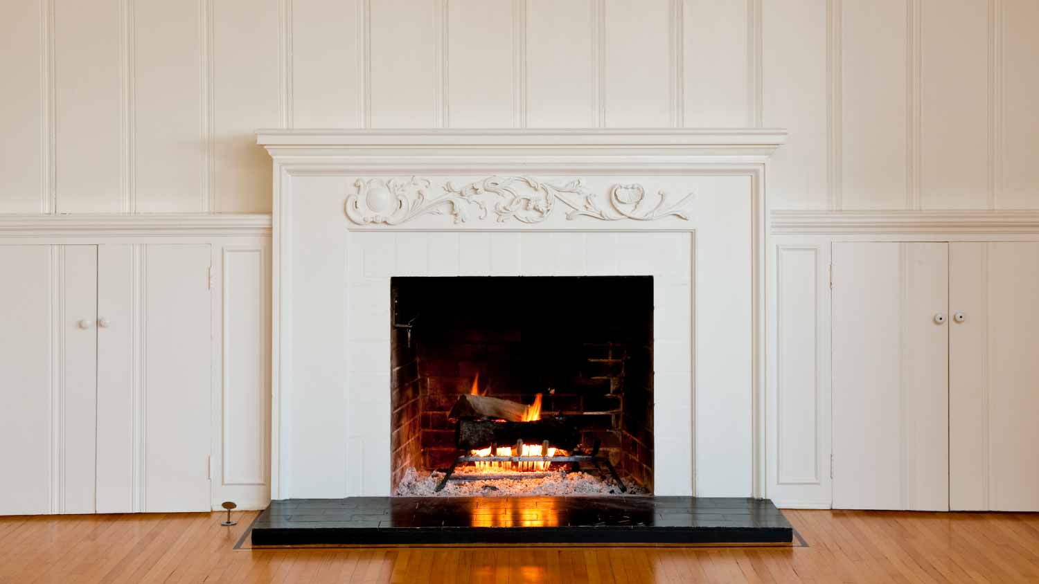 Traditional fireplace in empty room