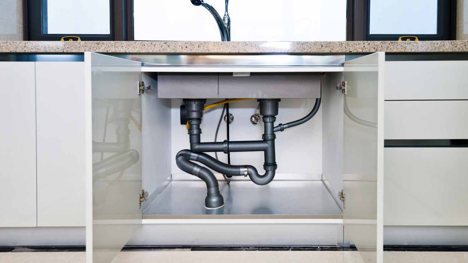 Water pipe under kitchen sink