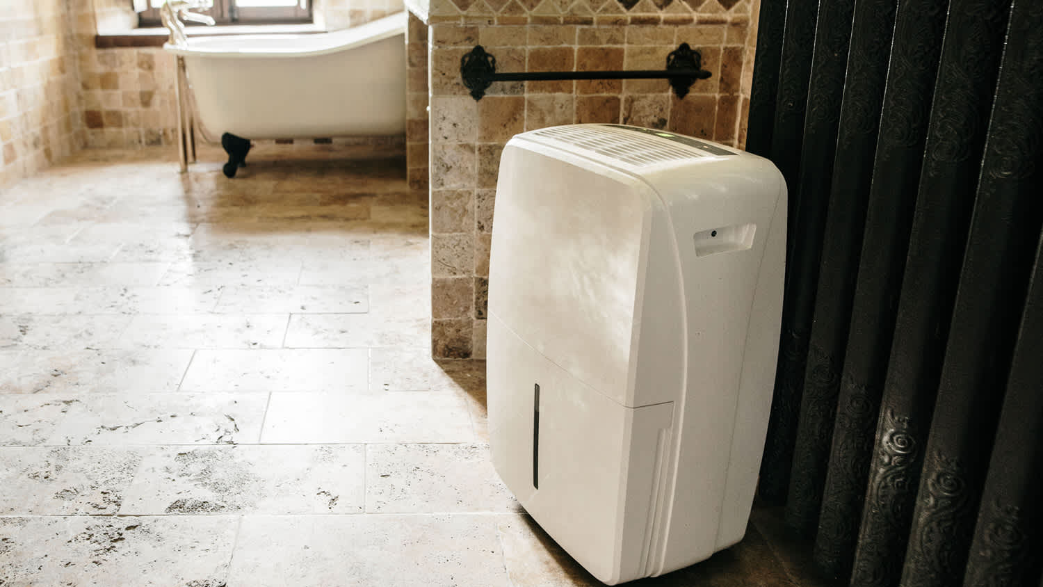 A dehumidifier device in a bathroom