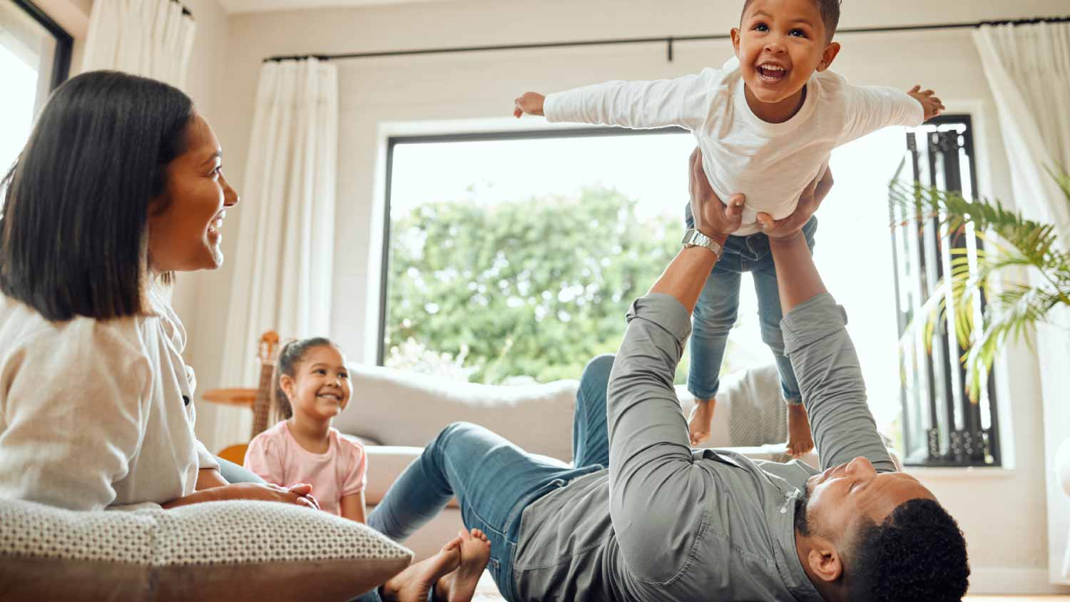 Family playing together on the lounge floor